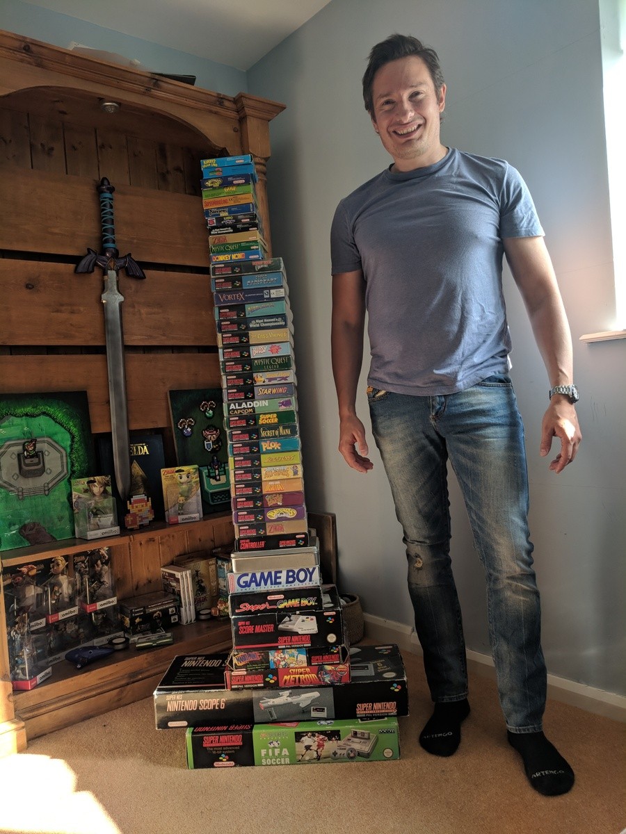 Alex with his pile of games today. As you can see, he's grown a bit since 1994.