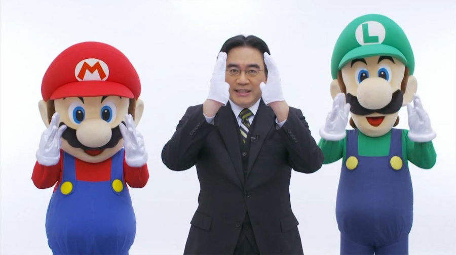 Satoru Iwata performing his "directly to you" pose