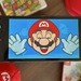Feature: Nintendo's New App Reminds Me Of A Universal Truth: It Feels Good To Squash Mario's Face