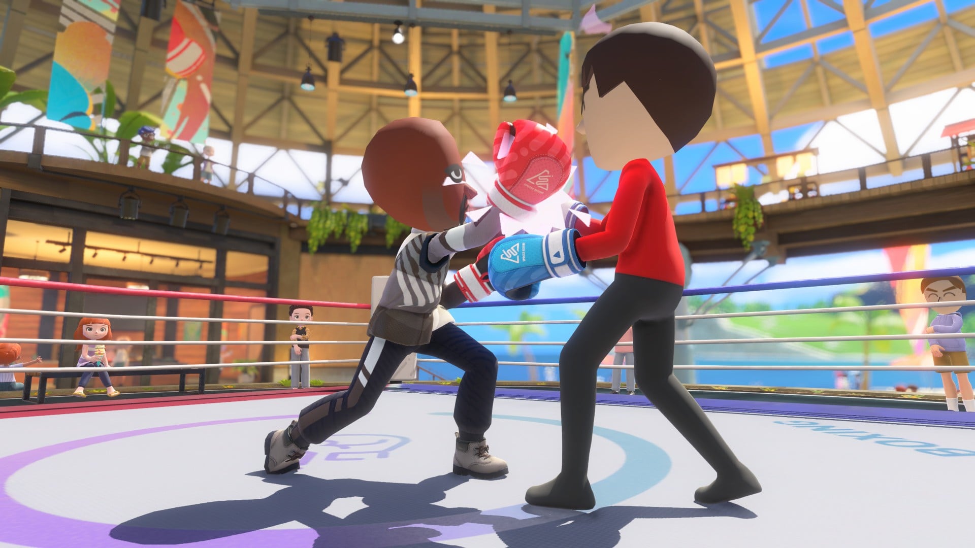 Nintendo Switch Sports Resort boxing match with two Miis trading punches in a brightly lit arena