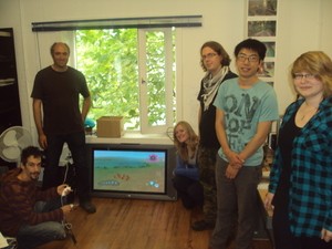 The Onteca Team with their big TV on the floor