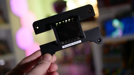 The top of the Virtual Boy accessory flips open to reveal the aperture into which you place your Switch or Switch 2 console. The unit comes with the Switch 2 plate installed, but there's a Switch 1 plate included in the box if you have the original model. You'll need a screwdriver to install it, however