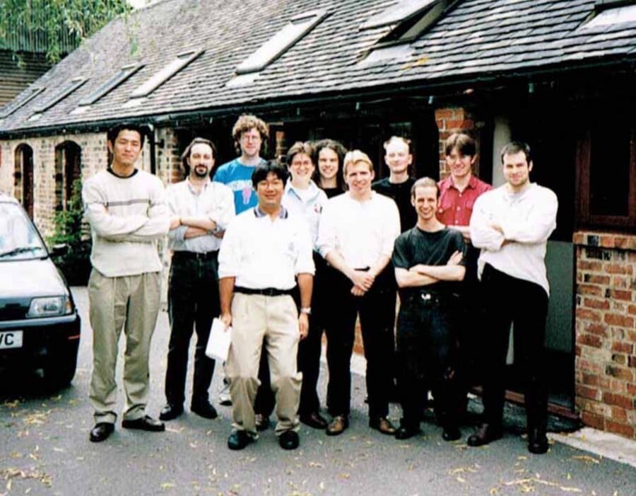 The GoldenEye 007 development team outside one of the barns at Rare's Manor Farm HQ