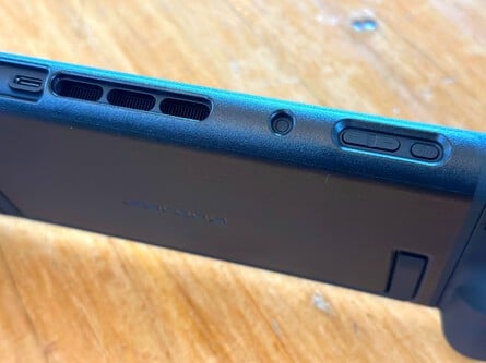 A close-up of the bevelled and die-cut cart USB-C, vent, power button, and volume control slots