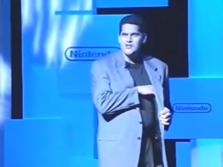 What is Reggie about to pull out of his pocket in this pic?