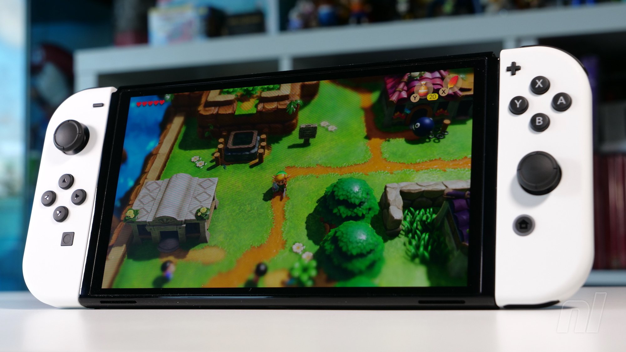 The Switch OLED has a screen protector attached, but don't remove it,  Nintendo says. – XijiGame