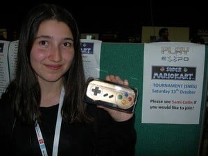 Leyla with her golden SNES pad, won at the recent Play Expo in the UK