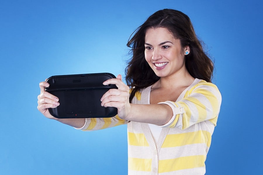 Woman holding a Wii U GamePad