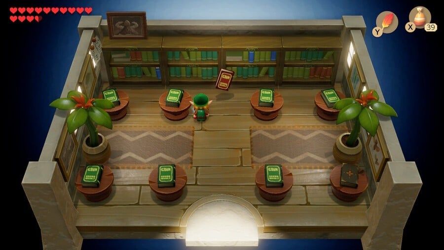 Link runs head-first into a shelf of books