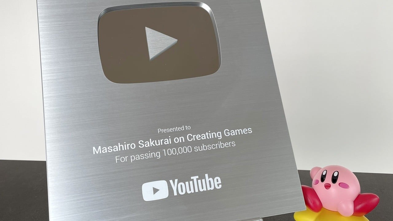 Zufällig: Masahiro Sakurai zeigt einen silbernen YouTube-Play-Button
