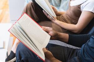 Man Reading Book Beside Woman Reading Book 545068