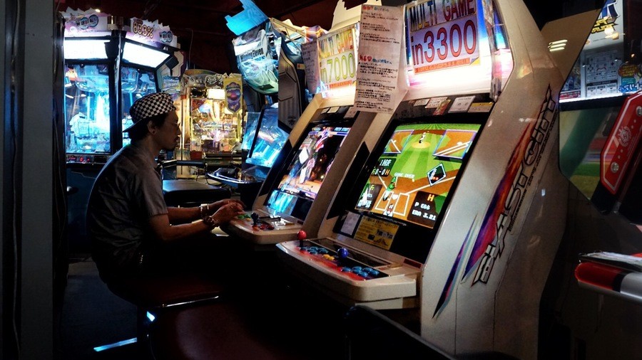 An arcade-goer plays on a Sega Blast City cabinet offering 7,000 games in the Sega High-Tech Land arcade in Tateishi, Tokyo